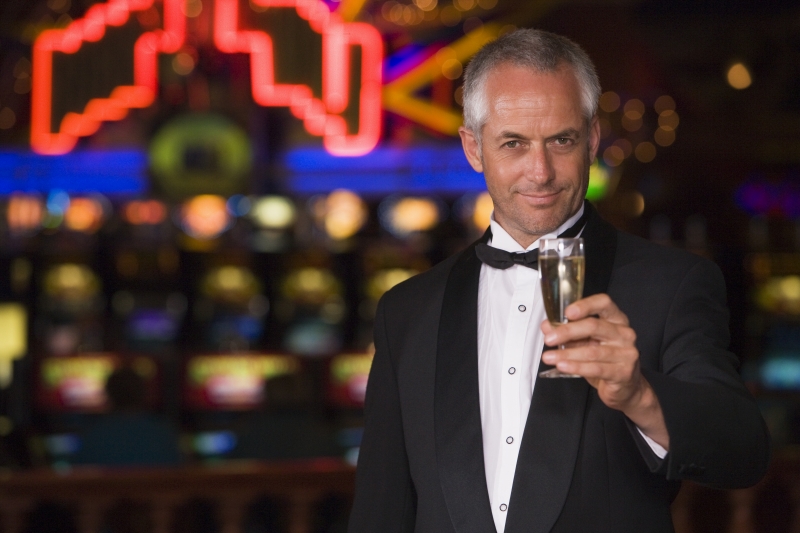 2124426-man-in-tuxedo-drinking-champagne-in-casino